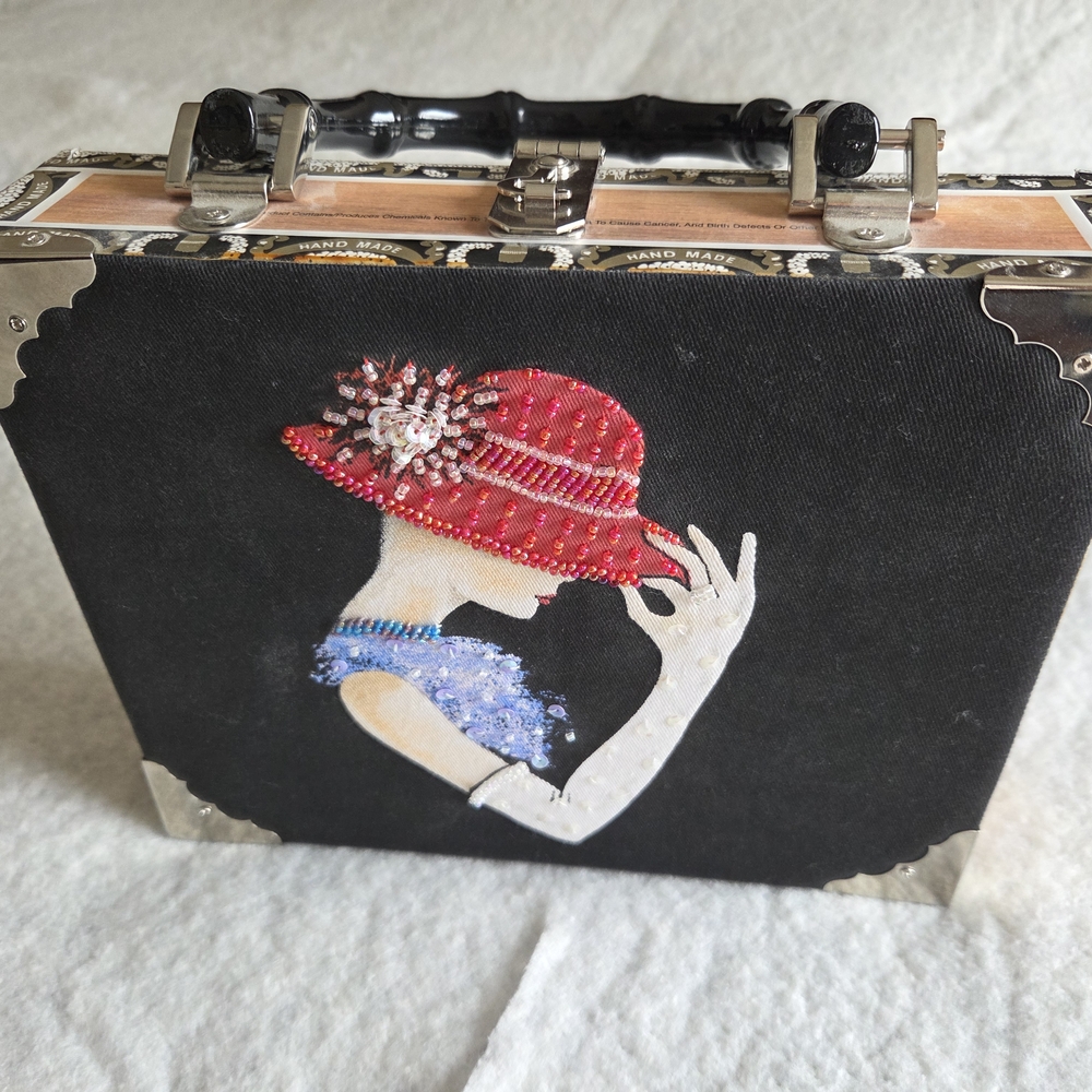 Elegant Black and Red Handbag with Embellished Design